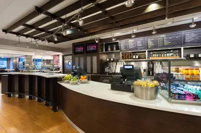 a bar in a restaurant with a counter top at Courtyard Miami Downtown Brickell Area in Miami