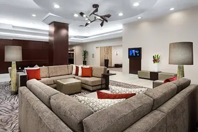 a large living room with a large couch at Courtyard Miami Downtown Brickell Area in Miami