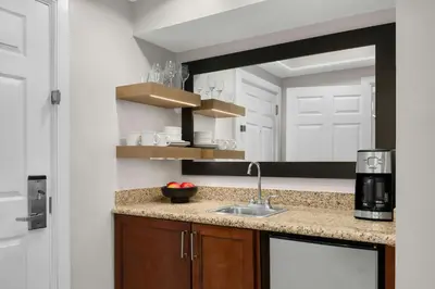 a kitchen with a sink and a mirror at Marriott's BeachPlace Towers in Fort Lauderdale