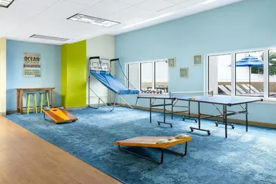 a play room with a slide and ping pong tables at Marriott's BeachPlace Towers in Fort Lauderdale