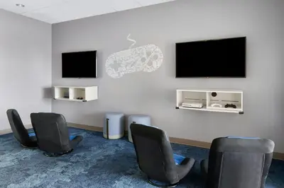 a waiting room with chairs and a flat screen tv at Marriott's BeachPlace Towers in Fort Lauderdale