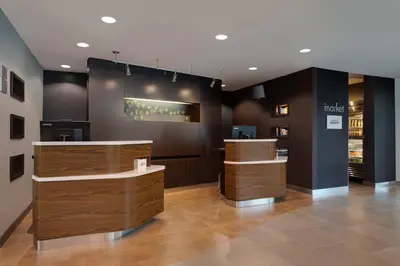 a restaurant with wooden counters in a room at Courtyard Fort Lauderdale SW Miramar in Miramar