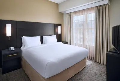 a bedroom with a large white bed and a window at Residence Inn Fort Lauderdale SW/Miramar in Miramar