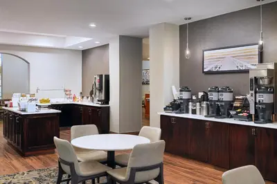 a room with a table and chairs and a coffee shop at Residence Inn Fort Lauderdale SW/Miramar in Miramar