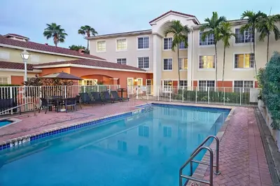 a swimming pool in front of a building at Residence Inn by Marriott Fort Lauderdale Weston in Weston