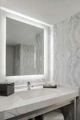 a bathroom with a sink and a mirror at Courtyard by Marriott Miami Aventura Mall in Aventura