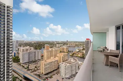 a view of a city from the balcony of a building at Luxurious Hyde Resort Apartments in Hollywood
