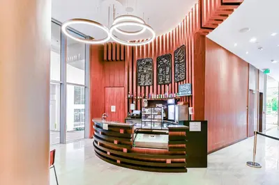 a bar in a restaurant with wooden walls at Luxurious Hyde Resort Apartments in Hollywood