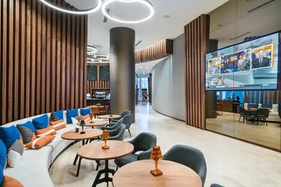 a restaurant with couches and tables and chairs at Luxurious Hyde Resort Apartments in Hollywood