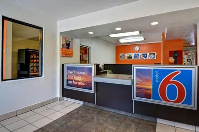 a fast food restaurant with a sign on the wall at Motel 6 Dania Beach in Dania Beach