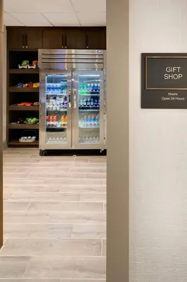 a gift shop with an open refrigerator in a store at Sheraton Suites Fort Lauderdale West in Plantation