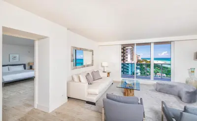 a living room with a couch and a table at Oceanfront Private Condo at 1 Hotel & Homes -1019 in Miami Beach