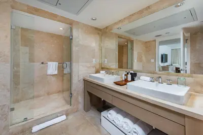 a bathroom with two sinks and a shower at Oceanview Private Condo at 1 Hotel & Homes -1040 in Miami Beach