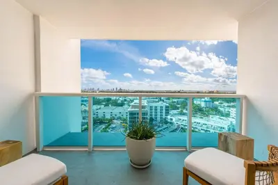 a room with a large window with a view of a city at Luxurious Private Condo at 1 Hotel & Homes -1445 in Miami Beach