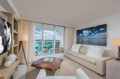 a living room with a couch and a table at Luxurious Private Condo at 1 Hotel & Homes -1445 in Miami Beach