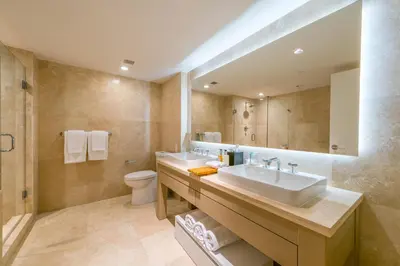 a bathroom with a sink and a toilet and a mirror at Luxurious Private Condo at 1 Hotel & Homes -1445 in Miami Beach