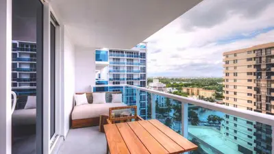 a balcony with a bench and a table on a balcony at Oceanview Private Condo at 1 Hotel & Homes -1211 in Miami Beach