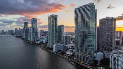 a view of a city with a river and buildings at Up Midtown in Miami