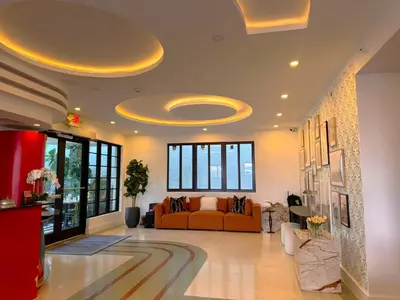 a living room with a couch in a room at The Cove By Renzzi in Miami Beach