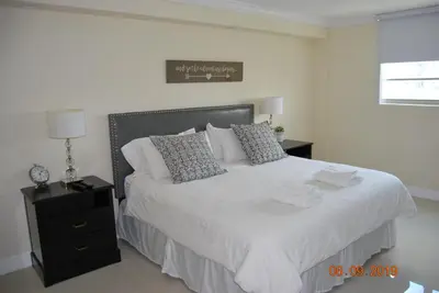 a bedroom with a large bed with white sheets and pillows at Ocean Reserve Piso 7 STR-310 in Miami Beach