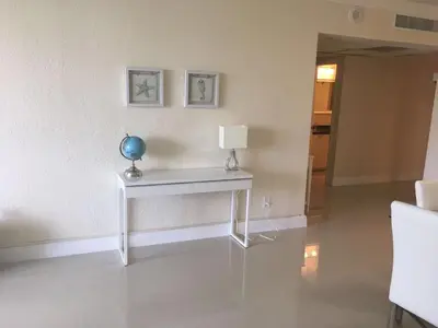 a white table with a vase on it in a room at Ocean Reserve Piso 4 STR264 in Miami Beach