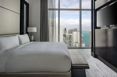 a bedroom with a large white bed and a large window at JW Marriott Marquis Miami in Miami