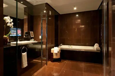 a bathroom with a bath tub and a sink at JW Marriott Marquis Miami in Miami