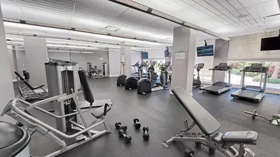 a gym with several cardio machines and people in it at THE TIDES 2 bedrooms 9th floor WE ARE ON THE BEACH! in Hollywood