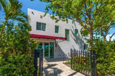 a building with a gate in front of it at Costa Norte Boutique Hotel Miami Beach in Miami Beach