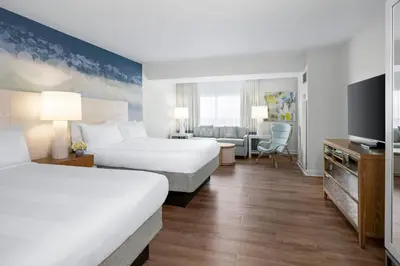a hotel room with two beds and a television at Marriott Vacation Club, South Beach in Miami Beach