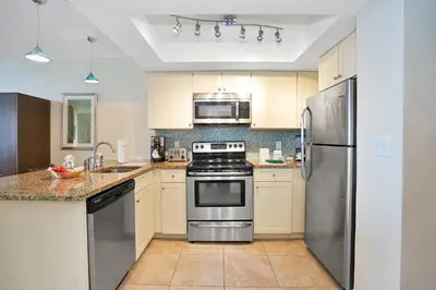 a kitchen with a stove and a refrigerator at Hollywood Beach Tower in Hollywood