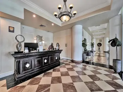 a lobby with a cash register in a building at King David Condominium Sunny Isles Beach in Miami Beach