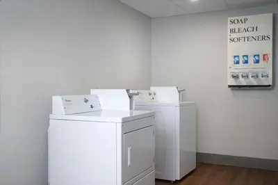 two white refrigerators in a room with a sign at Spark by Hilton Miami Doral in Miami