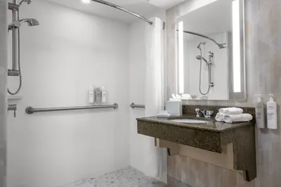 a bathroom with a sink and a shower at Hampton Inn Miami-Airport West in Miami