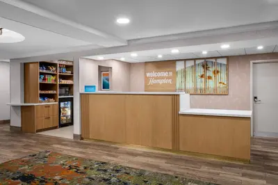a lobby of a pharmacy with a waiting room at Hampton Inn Miami-Airport West in Miami