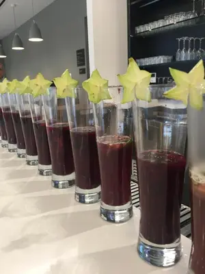 a row of glasses filled with brown drinks on a counter at Wyndham Garden Ft Lauderdale Airport & Cruise Port in Dania Beach