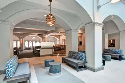 a lobby with couches and chairs in a building at Embassy Suites by Hilton Miami International Airport in Miami