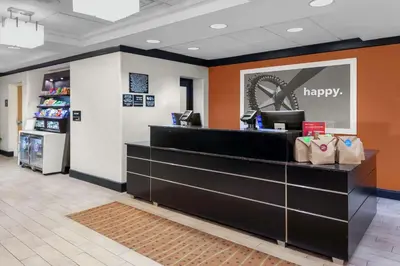 a lobby of a happy pharmacy with a happy counter at Hampton Inn Miami/Dadeland in South Miami