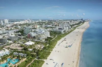 an aerial view of a beach and the ocean at Hilton Bentley Miami South Beach in Miami Beach