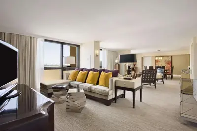 a living room with a couch and a table at Hilton Miami Airport Blue Lagoon in Miami