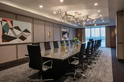 a conference room with a long table and chairs at Element Fort Lauderdale Downtown in Fort Lauderdale