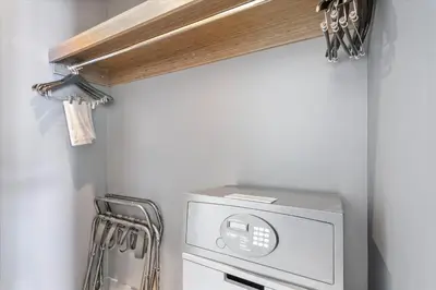 a microwave in a kitchen with a shelf at 1201 W Residences in Fort Lauderdale