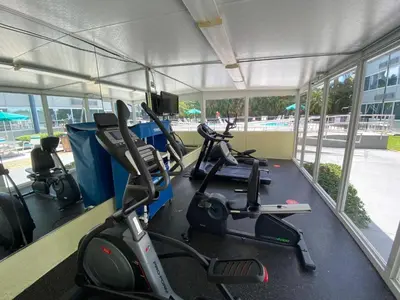 a gym with several exercise bikes in a building at enVision Hotel Miami International Airport in Miami