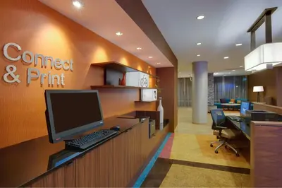 an office cubicle with a computer on a desk at Fairfield Inn & Suites By Marriott Fort Lauderdale Downtown/Las Olas in Fort Lauderdale