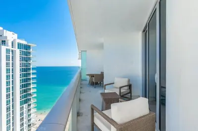 a balcony with a view of the ocean at 2 Bedroom on 17th floor on the beach Resort in Hallandale Beach