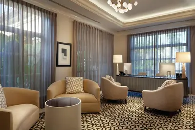 a hotel lobby with chairs and a waiting room at JW Marriott Miami Turnberry Resort & Spa in Aventura