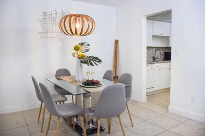 a dining room with a table and chairs at Coral Reef at Key Biscayne in Miami