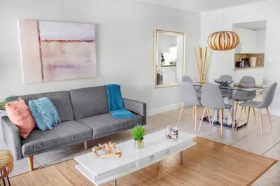 a living room with a couch and a table at Coral Reef at Key Biscayne in Miami