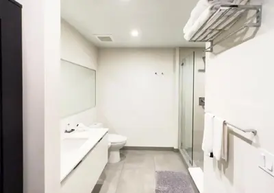 a white bathroom with a toilet and a sink at Global Rent Apart - Costa Hollywood in Hollywood