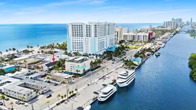 an aerial view of a city with boats in the water at Modern Loft wBed Steps from Beach Boardwalk in Hollywood